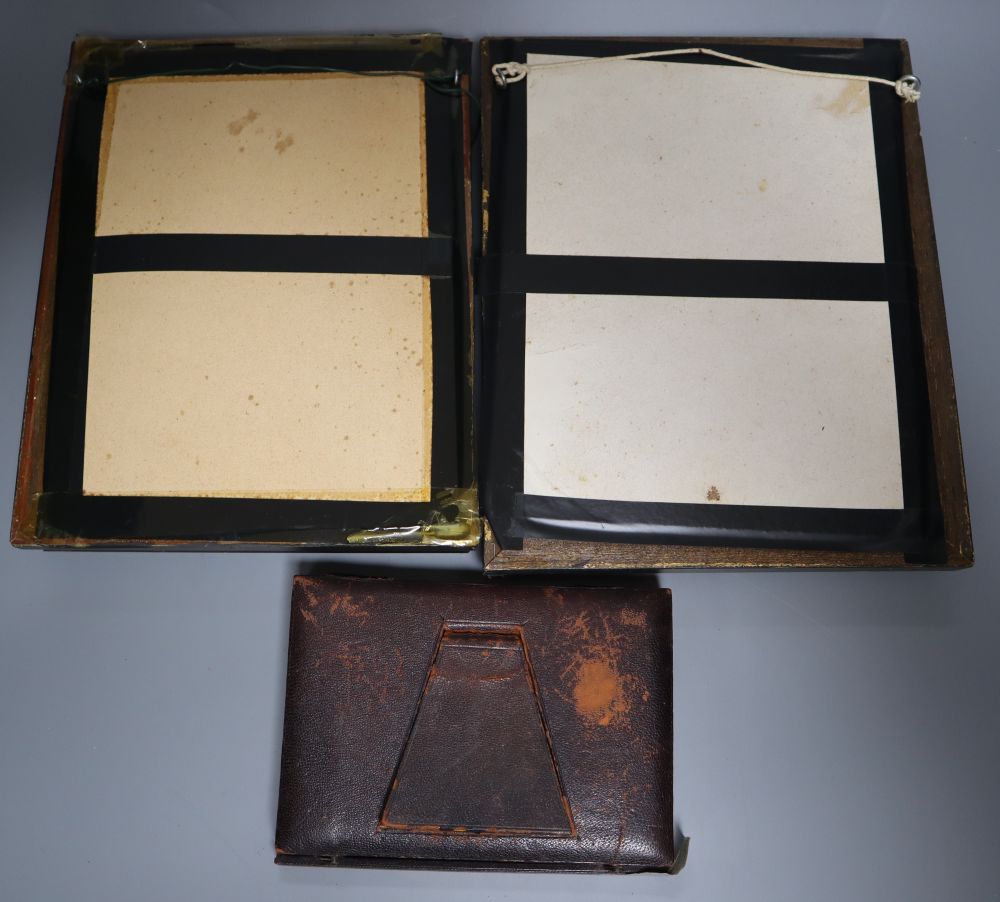 A collection of intaglio relief portrait plaques in a tray and a pair of framed sets